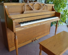 Story & Clark oak console piano